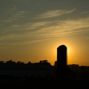 A farm at sunset.