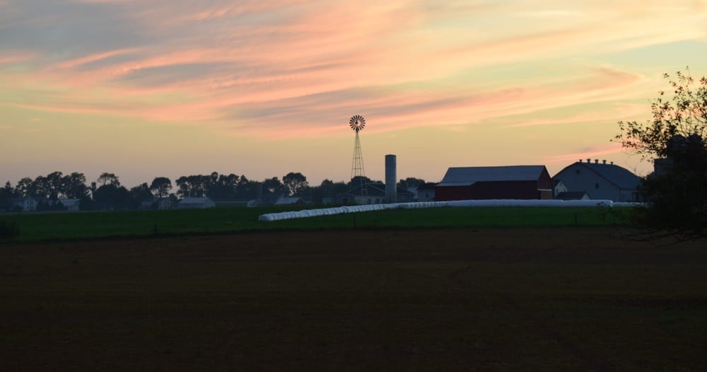 sunset over an amish farm